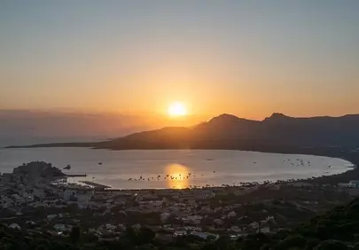 Breathtaking Calvi Sunrise: Golden Hues Over Corsica's Bay