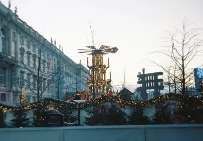 Enchanting Christmas Market: Illuminated Pyramid & Festive Stalls