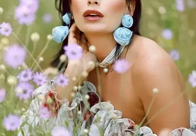 Enchanting Beauty Amidst Wildflowers: A Portrait of Feminine Grace