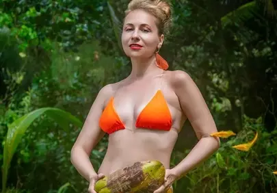 Exotic Paradise: Woman in Bright Bikini with Coconut