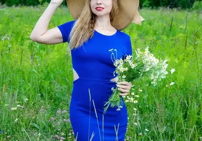 Stunning Lady in Blue Amidst a Summer Meadow