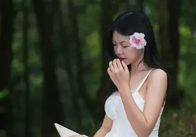 Serene Forest Reading: Woman in White with Pink Rose