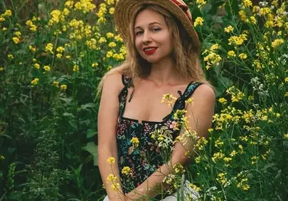 Stunning Summer Bloom: Woman in Field of Yellow Flowers