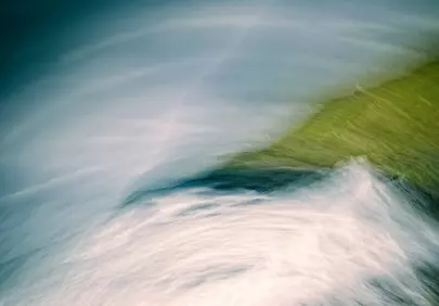 Dynamic Abstract: Swirling Water and Vibrant Grass