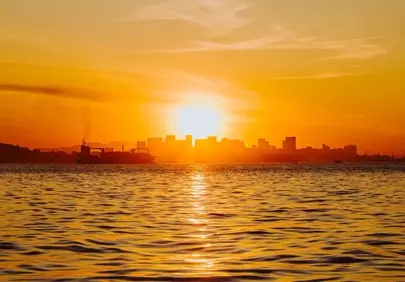 Fiery Brazilian Sunset: City Skyline Silhouetted by Golden Hues