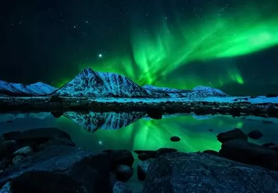 Breathtaking Aurora: Arctic Winter Nights Dance Over Majestic Mountains