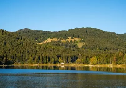 Serene Mountain Lake Reflecting Autumn's Embrace