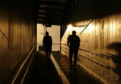 Dramatic Sunset Silhouettes in an Urban Underpass