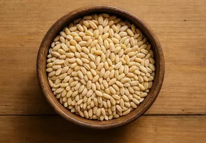 Golden Pearl Barley: Wholesome Grain in a Rustic Wooden Bowl