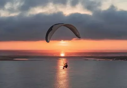 Breathtaking Paragliding Sunset over the Ocean