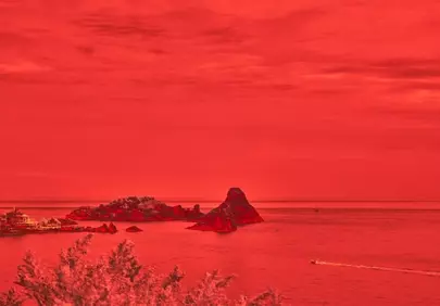 Dramatic Crimson Seascape: Rocky Isles and Distant Boat