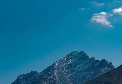 Majestic Snow-Capped Peak Under Azure Sky