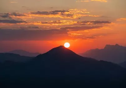 Fiery Sunset Over Majestic Alpine Peaks