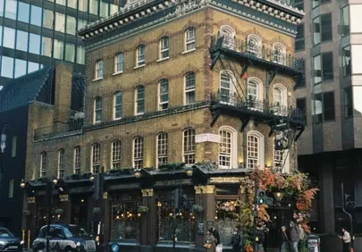 Timeless Elegance: Historic Building Amidst Modern Cityscape