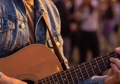 Enchanting Sunset Serenade: Acoustic Guitar Vibes Under Twinkling Lights