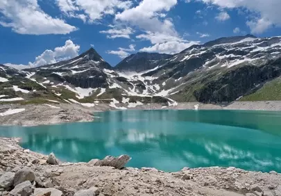Breathtaking Alps: Turquoise Lake Amidst Snowy Peaks