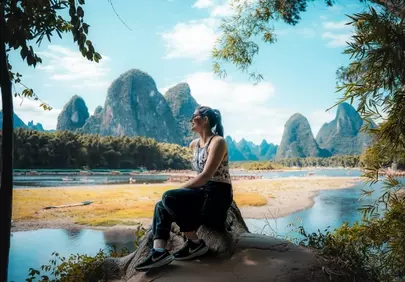 Breathtaking Karst Landscape: Woman Enjoys Nature's Majesty