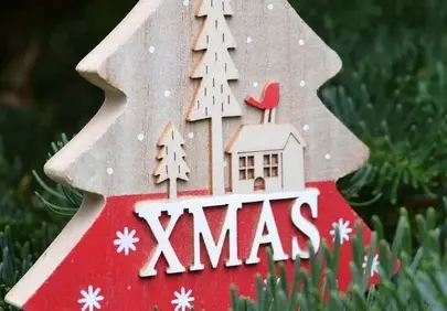 Charming Wooden Xmas Decoration on Lush Greenery