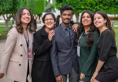 Diverse Group Smiling: A Joyful Campus Gathering