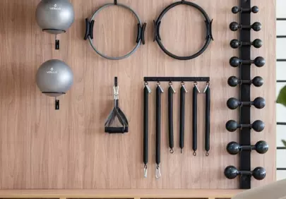 Zen Fitness: Organized Gym Equipment on a Stylish Wooden Wall