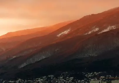 Breathtaking Autumn Dawn Over Foggy Mountain Slopes