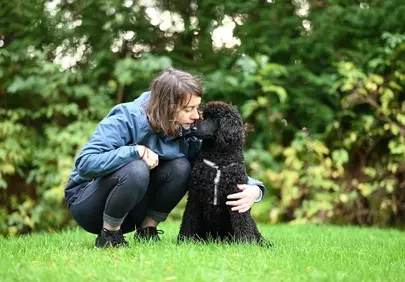 Heartwarming Bond: Girl and Her Royal Poodle Aglaé