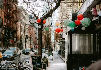 Vibrant Lanterns Adorn Snowy City Streetscape