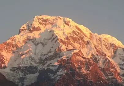 Majestic Himalayan Peak Bathed in Golden Sunrise