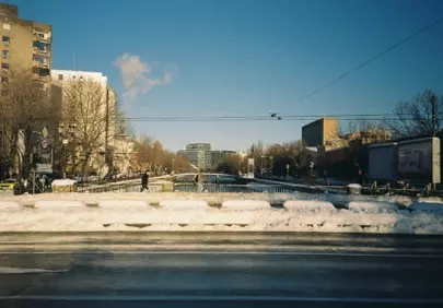 Winter's Embrace: Snowy Urban Vista on Film