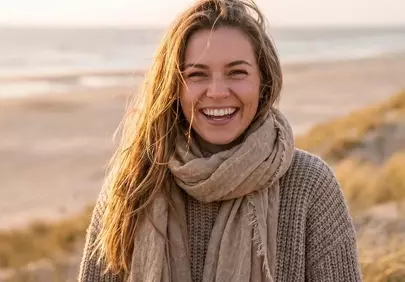 Radiant Blonde Woman on Beach at Golden Hour