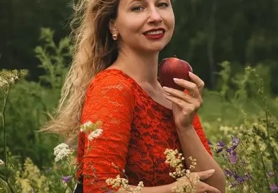 Radiant Beauty in Red: Summer Field Portrait
