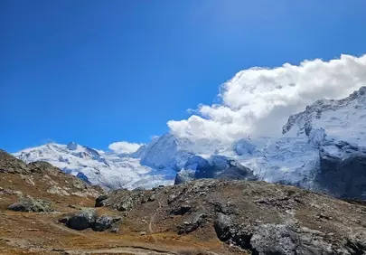 Majestic Alpine Vista: Snowy Peaks Under Azure Sky