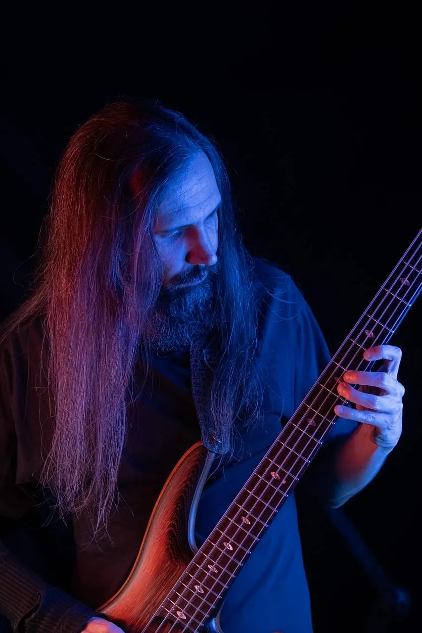 Dramatic Musician Portrait: Intense Bassist Under Neon Lights