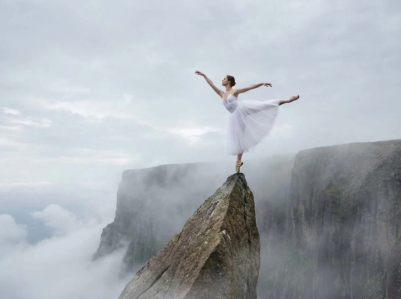 Breathtaking Ballet: Ethereal Dancer on Mountain Peak