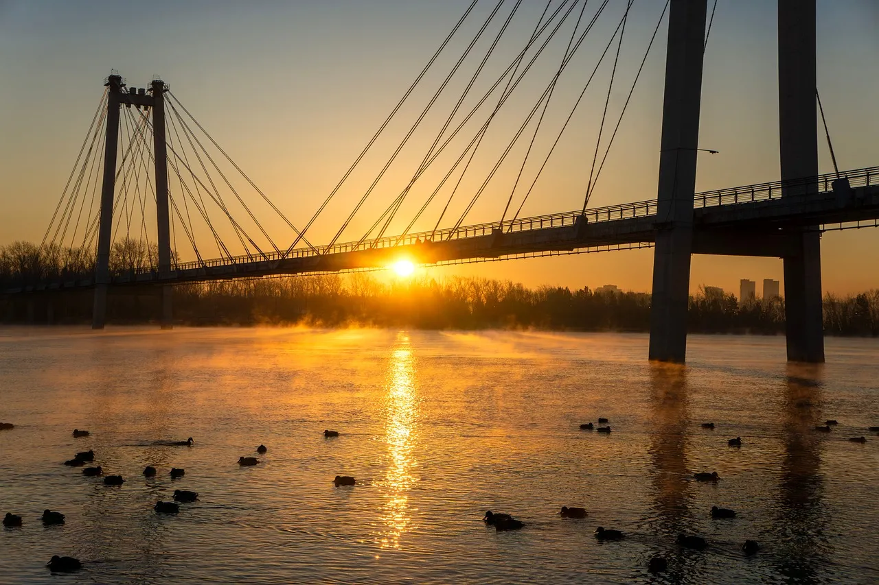 Golden Dawn: Majestic Bridge Over Misty River Sunset