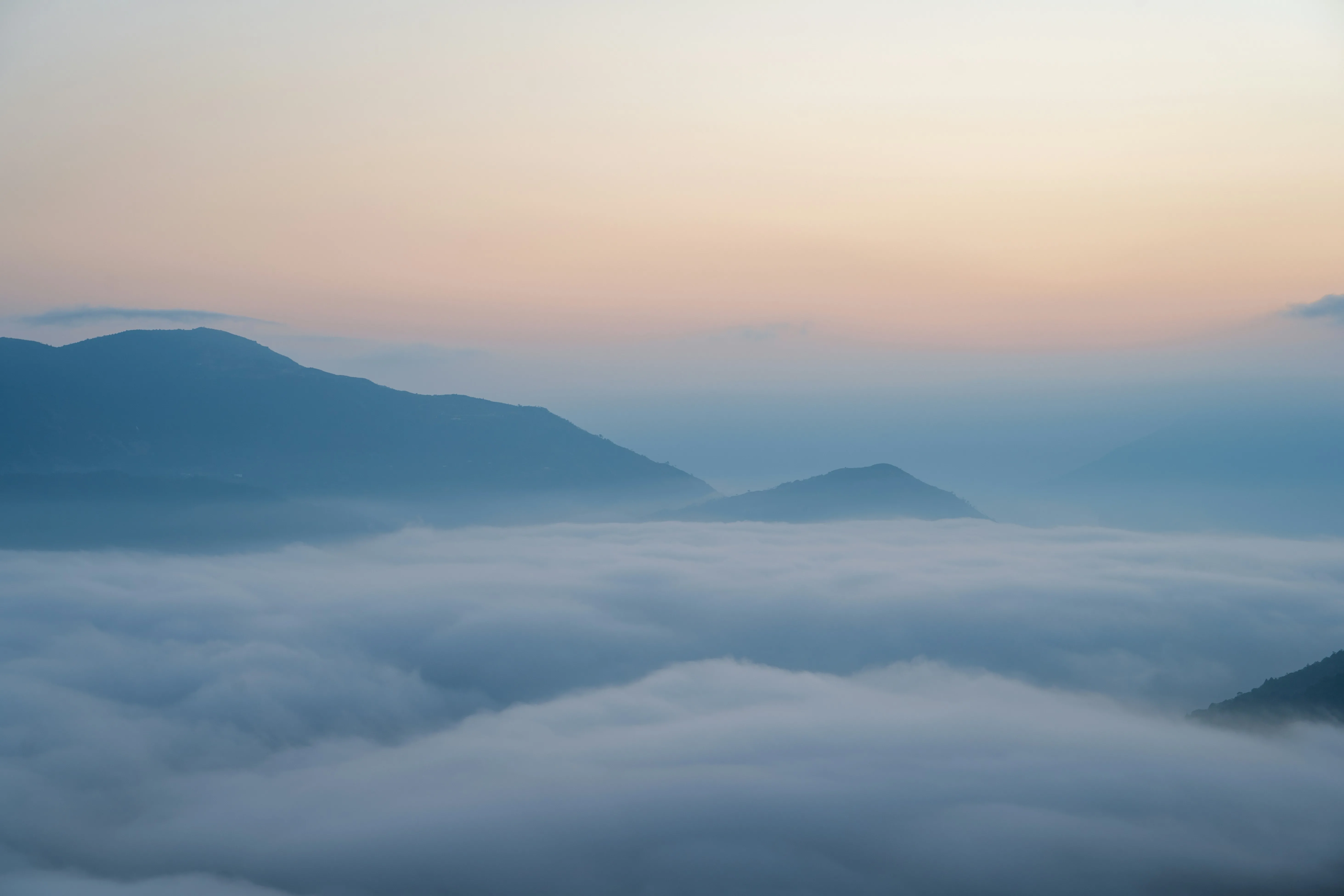 Misty Morning: Mountains Emerging from a Sea of Clouds