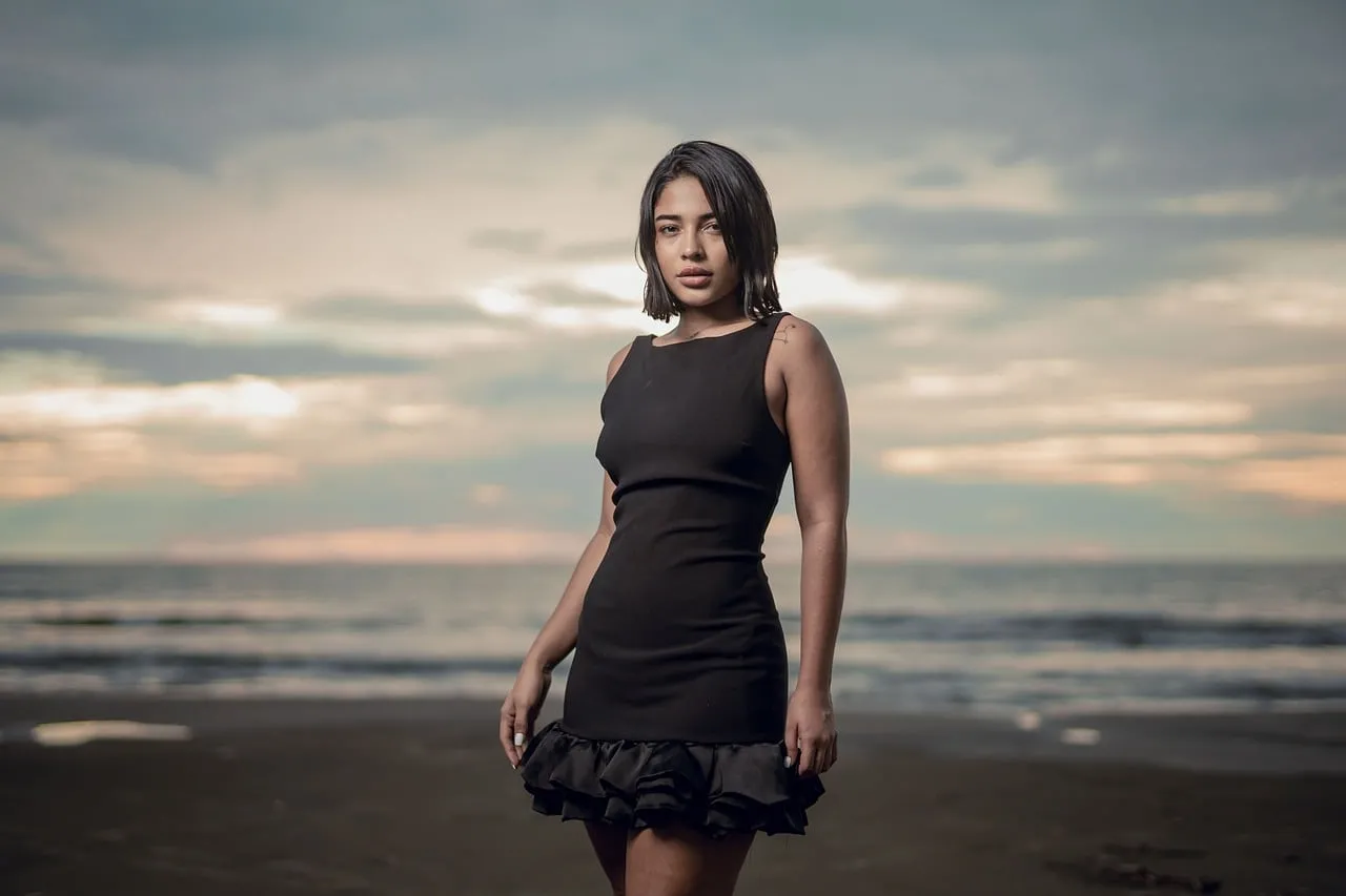 Stunning Beach Sunset Portrait: Elegant Model in Black Dress