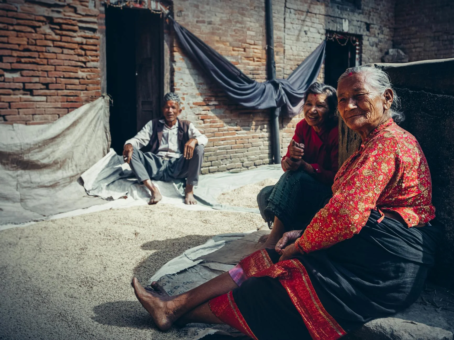 Authentic Glimpse: Serene Nepali Elders in a Rustic Village Setting