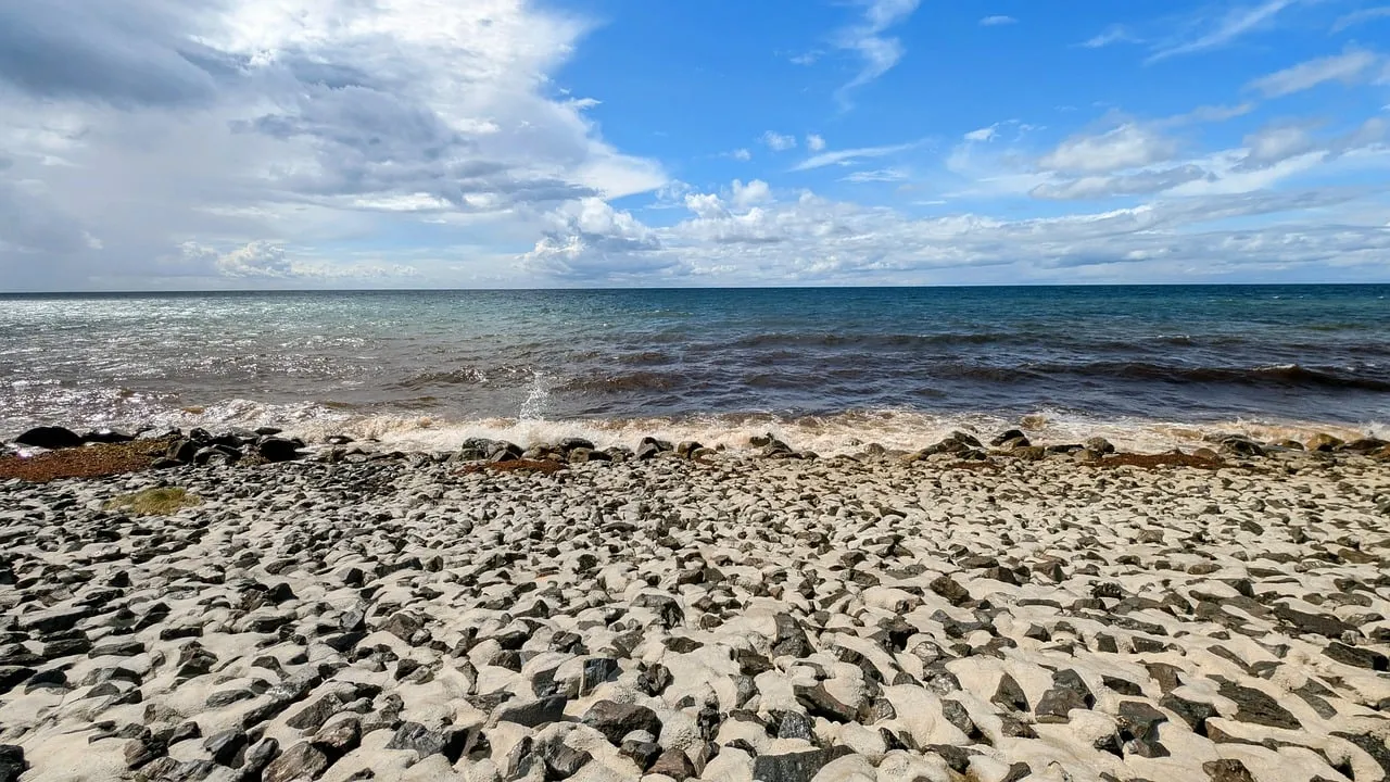 Serene Baltic Coastline: Rocky Beach Meets Endless Blue Sky