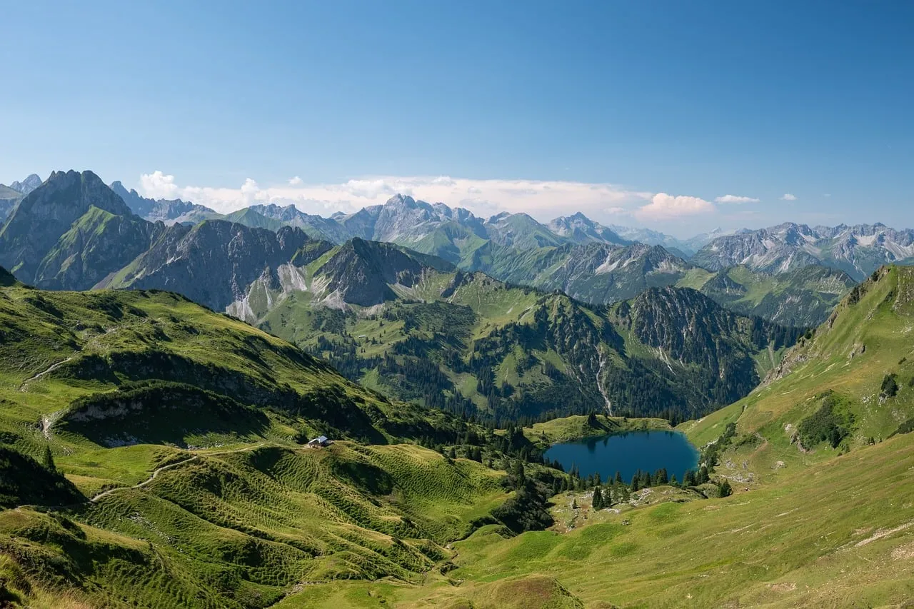 Breathtaking Alpine Panorama: Summer Peaks and Serene Lake Views