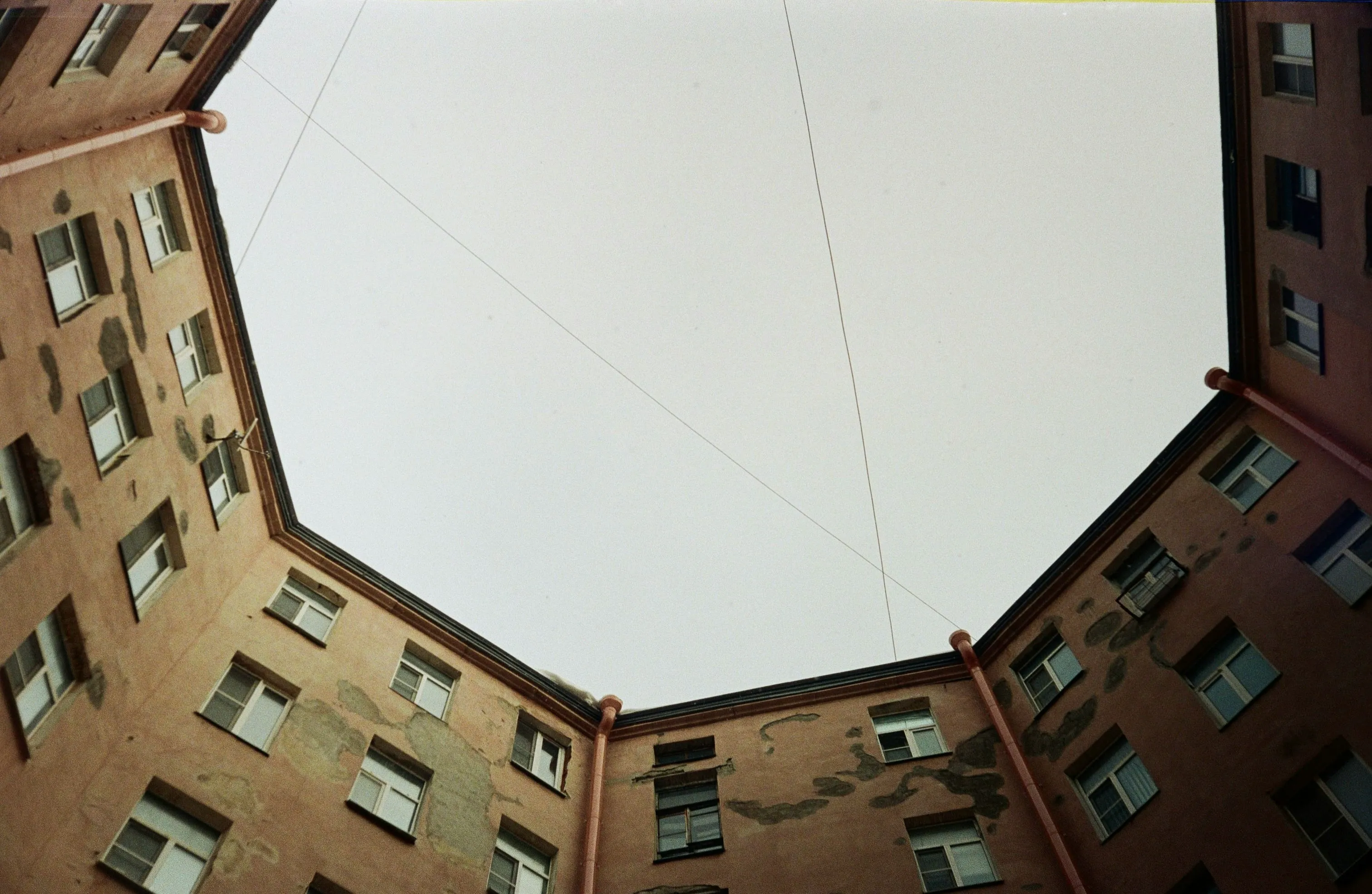 Dramatic Skyward Gaze: Urban Courtyard Architecture