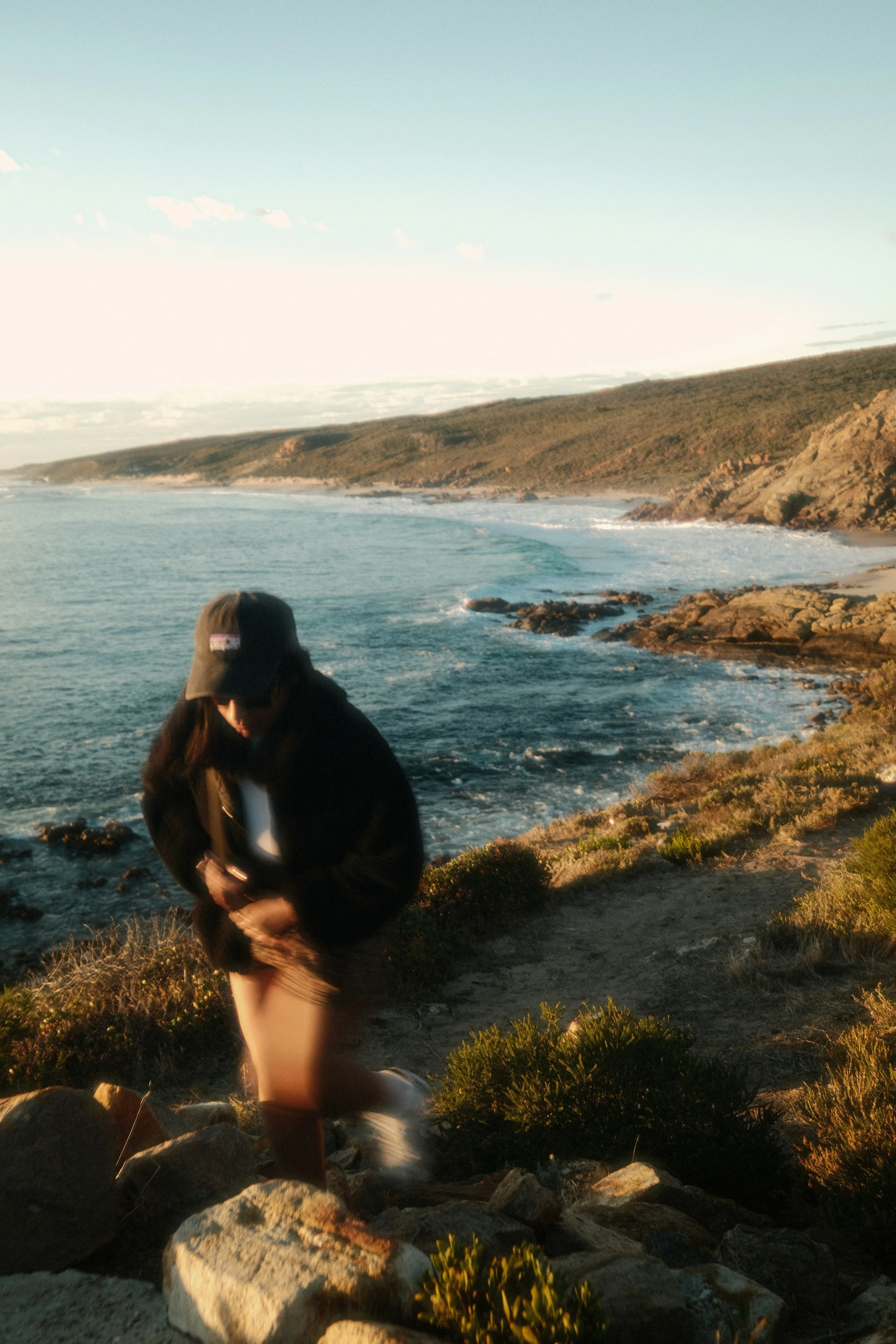 Breathtaking Coastal Hike: Girl Walking at Sunset by the Ocean