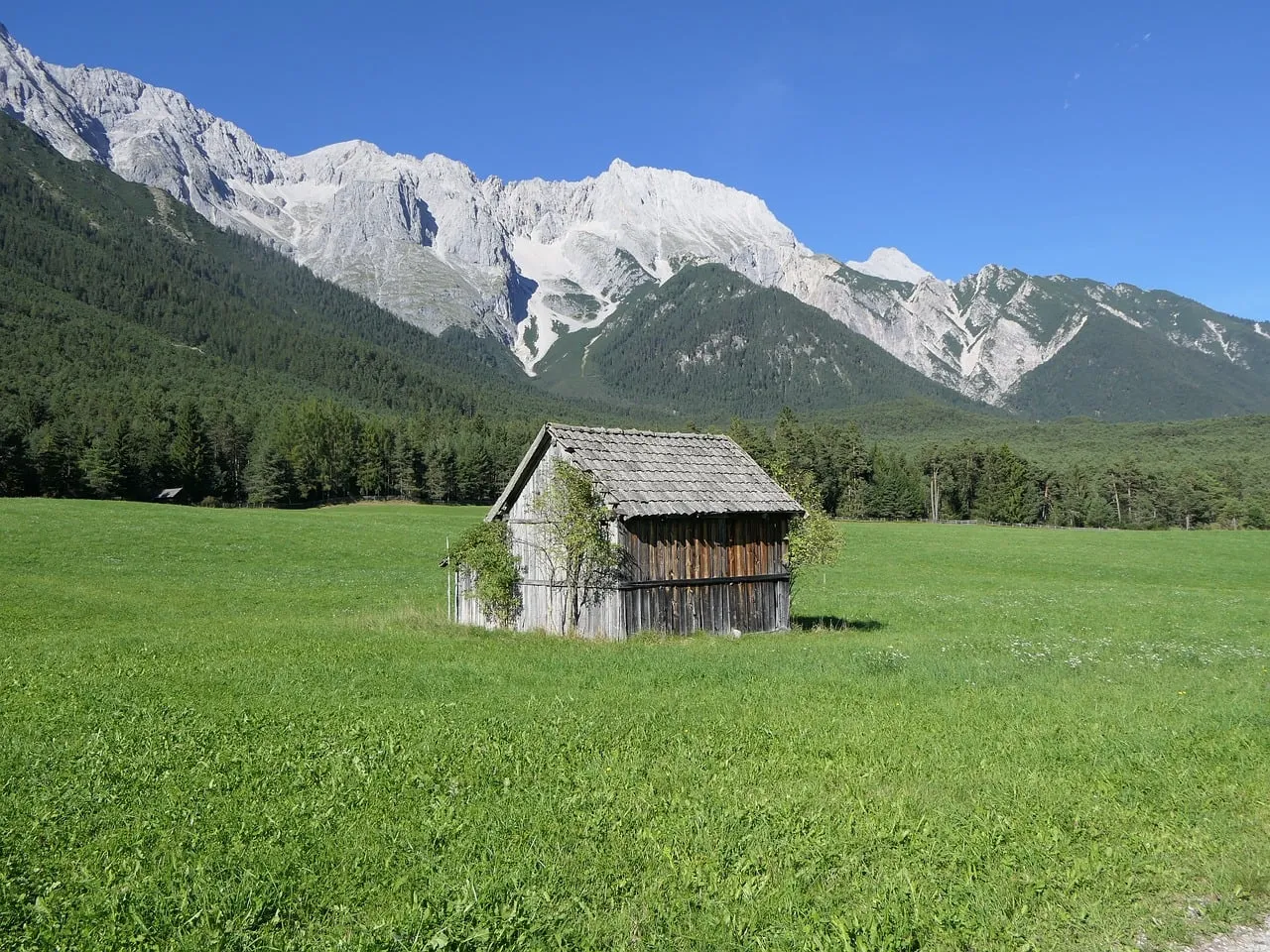 Breathtaking Alpine Retreat: Rustic Cabin Amidst Majestic Austrian Peaks