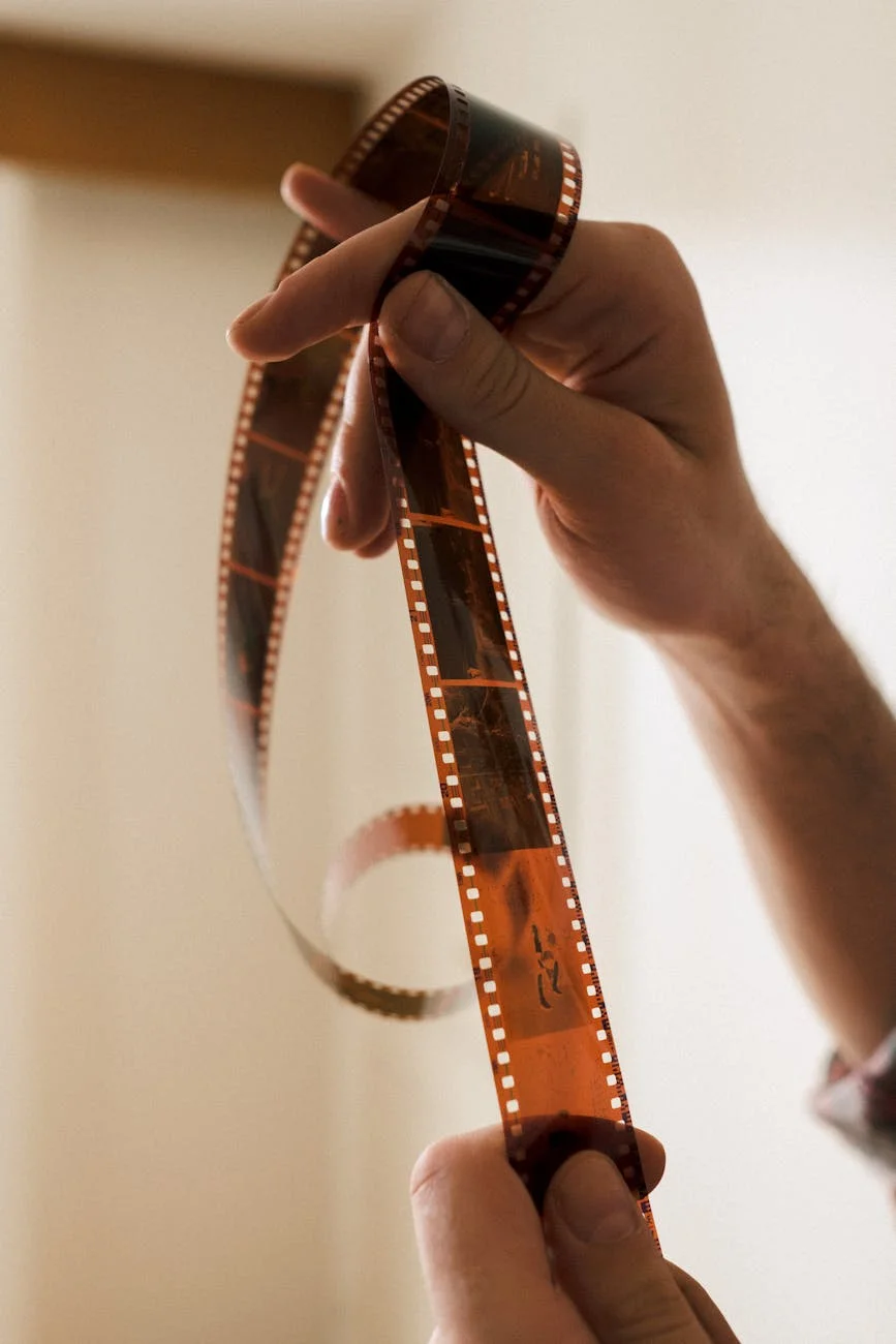 Timeless Capture: Hands Holding Vintage Film Reel