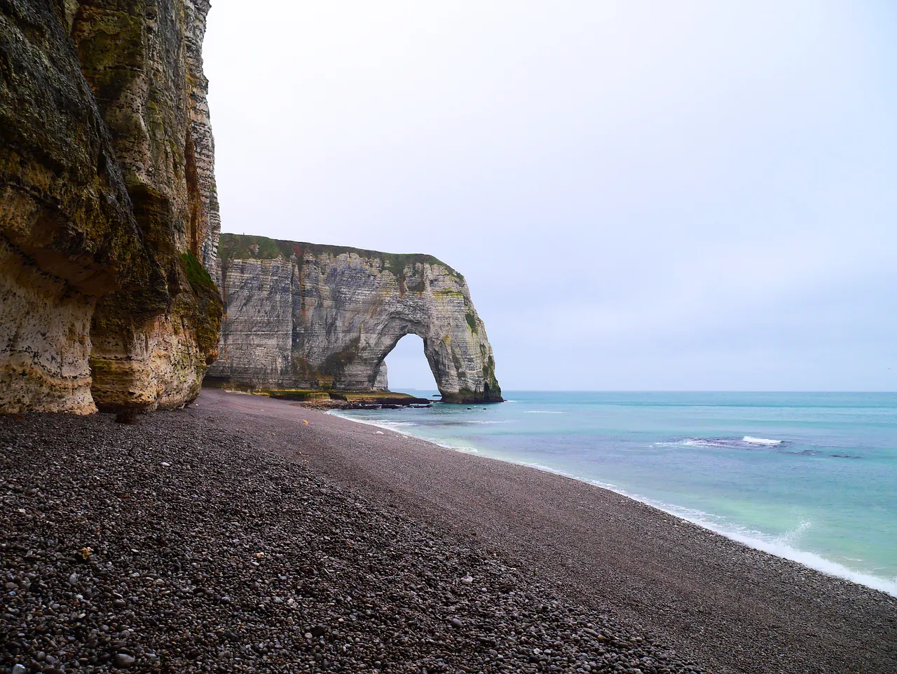 Breathtaking Étretat: Majestic Cliffs Meet Serene Pebble Beaches