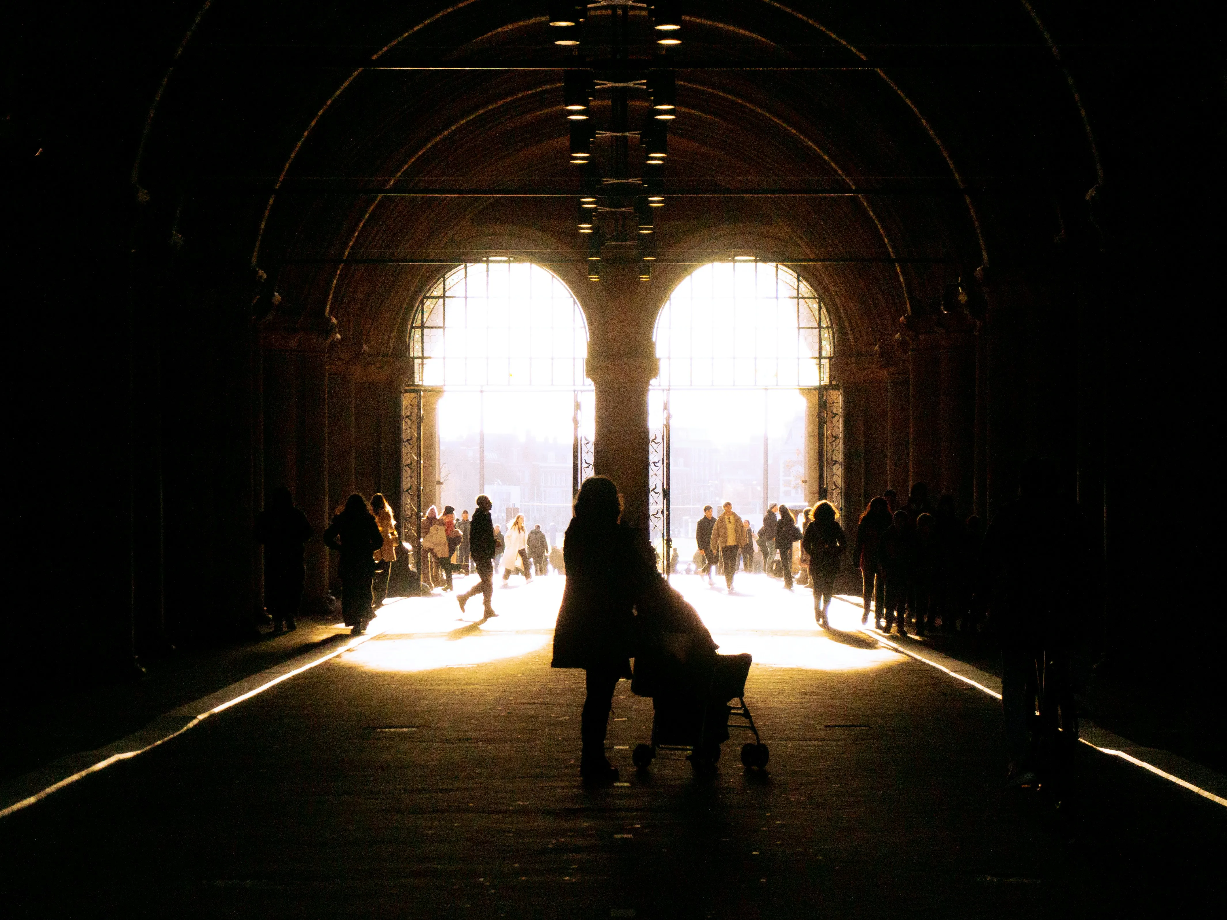 Dramatic Light: Silhouetted Figures in a Tunnel of Hope