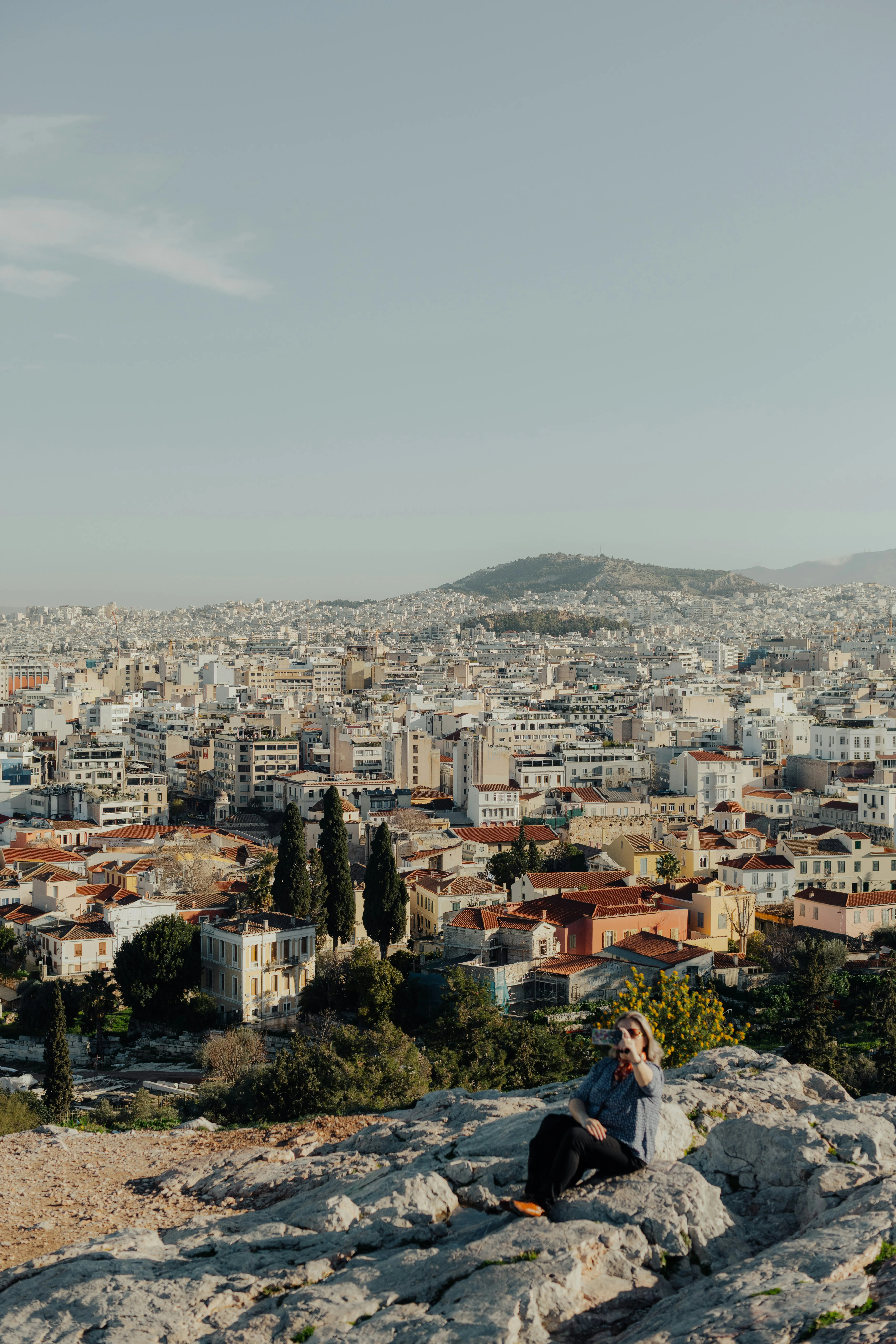 Breathtaking City Vista: Woman Admires Urban Landscape