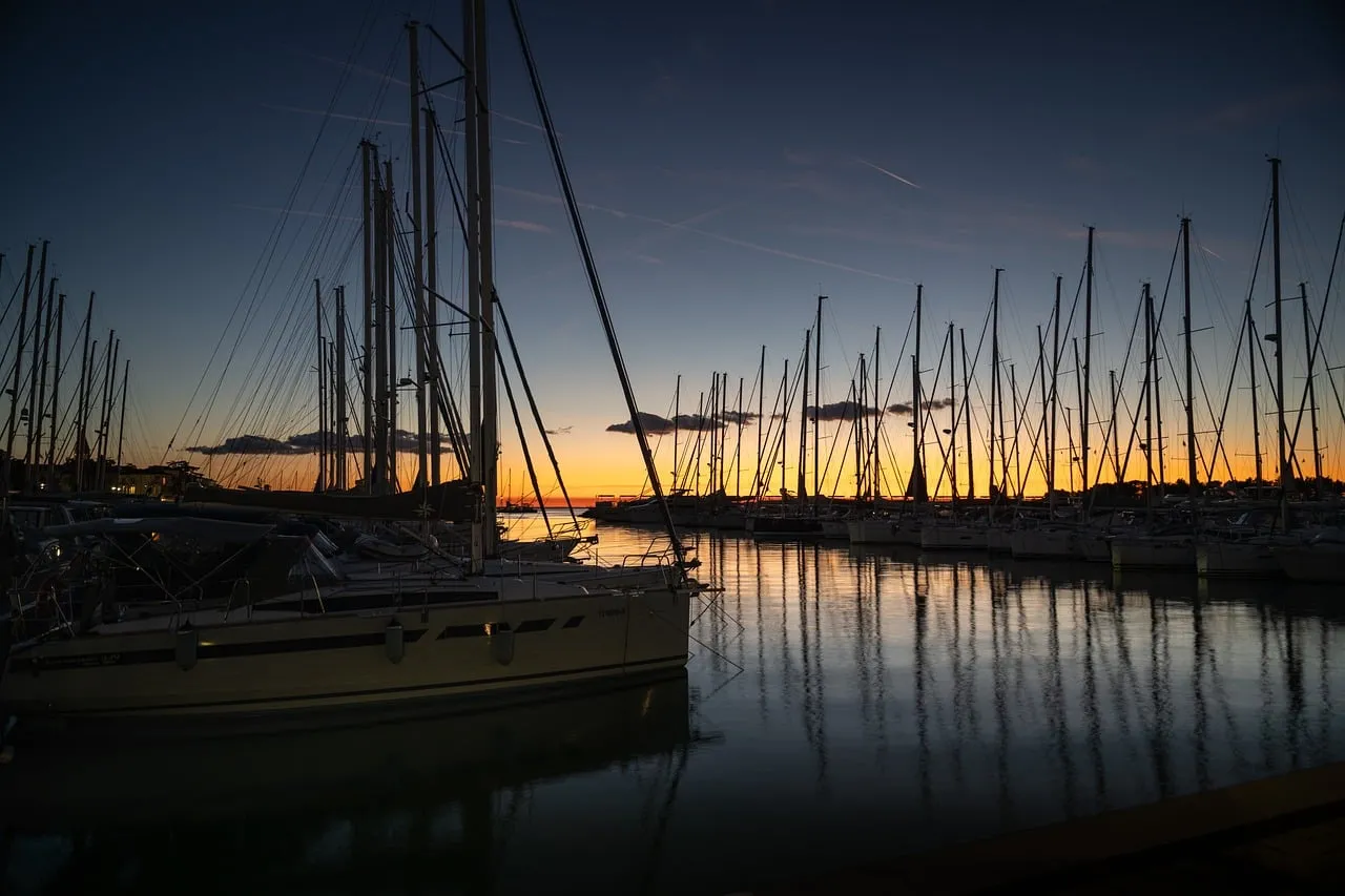 Stunning Sunset Serenity: Sailboats Reflecting Golden Hues