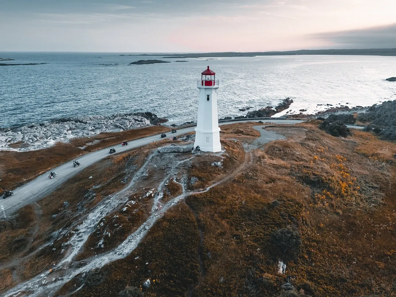 Dramatic Coastal Journey: Lighthouse at Sunset in Nova Scotia