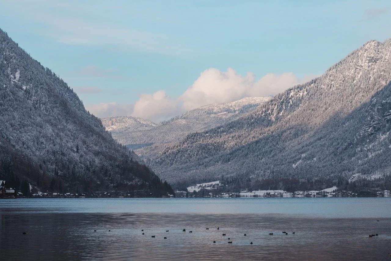 Serene Winter Wonderland: Majestic Mountains Meet Tranquil Lake